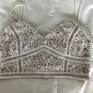 white crochet over tan crop top